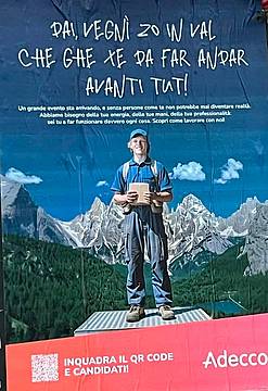 Il manifesto di Adecco che circola a Belluno in questi giorni e al centro di polemiche